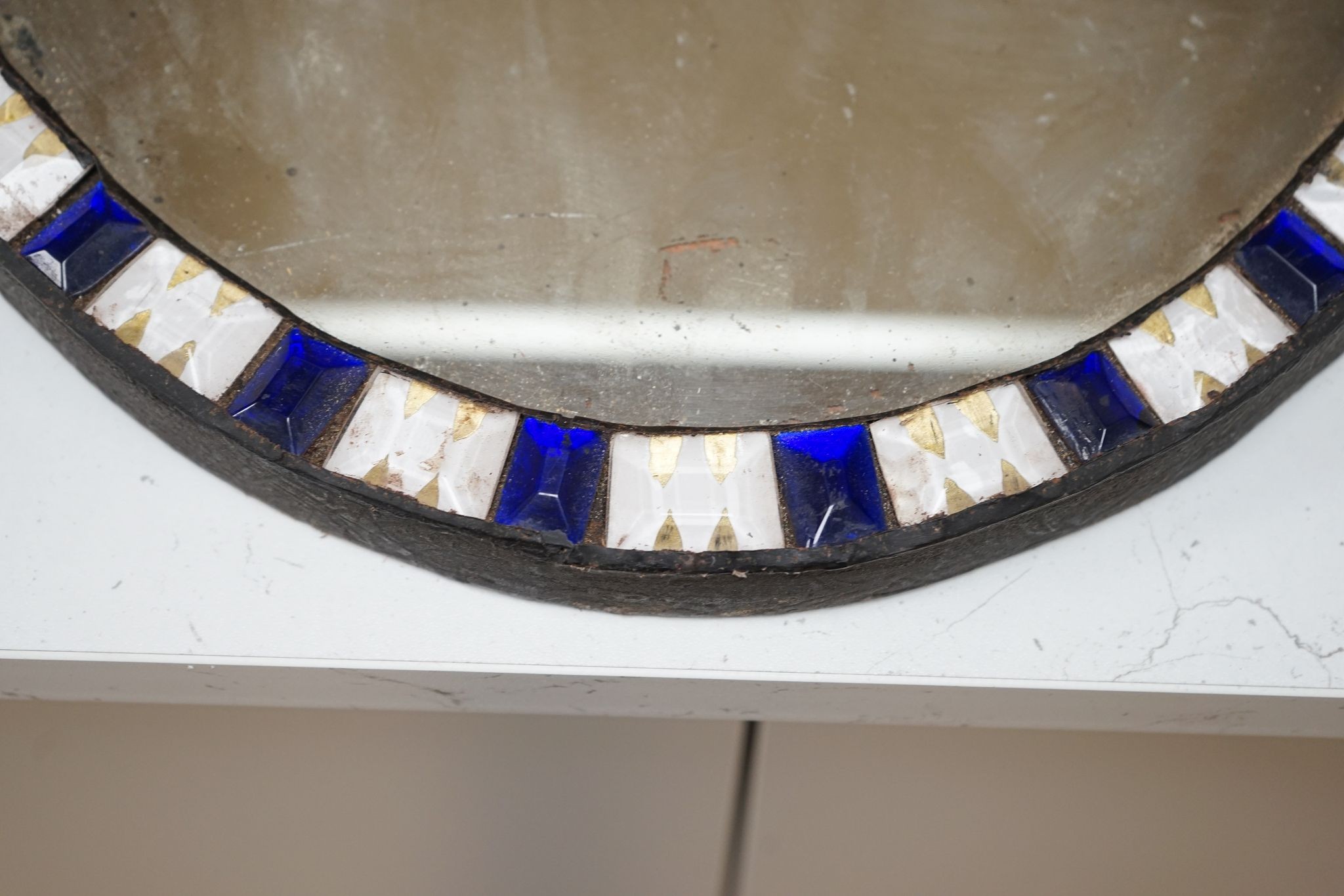 An oval Irish-style wall mirror, 56x41cm